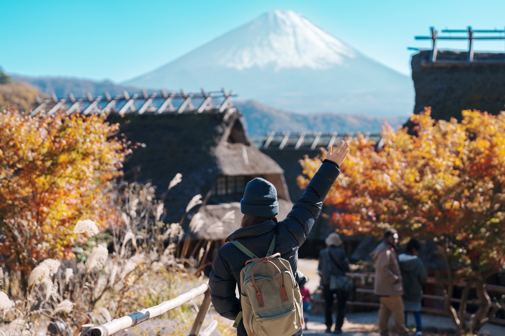 Woman tourist with mount Fuji in Silver Week