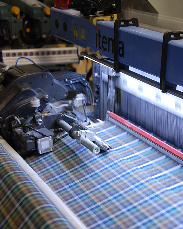 Fabric undergoing the application of anti-viral properties at Albini Group's manufacturing headquarters.