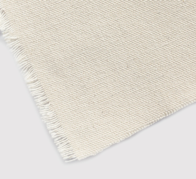 Cotton canvas is a durable, eco-friendly fabric commonly used for tote bag printing.