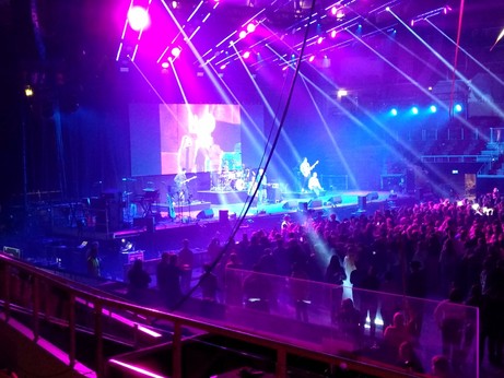Big crowd with artists and lights at a festival