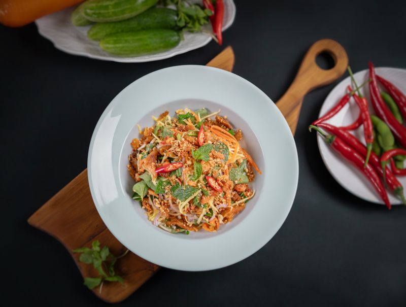 Green mango salad with smoked fish