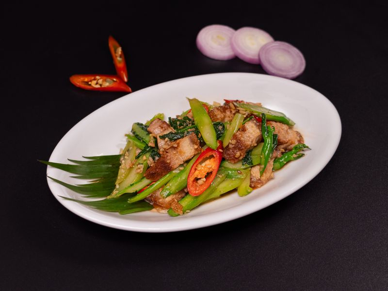 Stir-fried kai lan with roasted pork bell