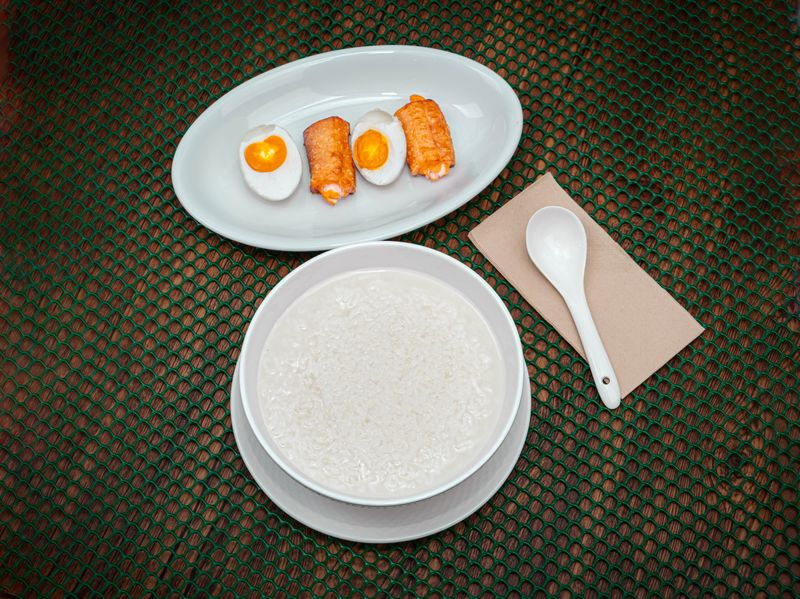 Porridge with dry fish and salted egg