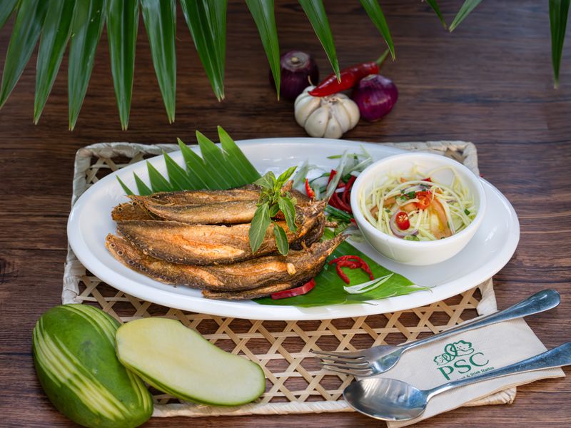 Deep fried green fish with young Mango salad​