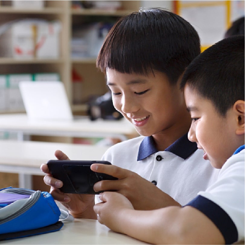Secondary school students using mobile device