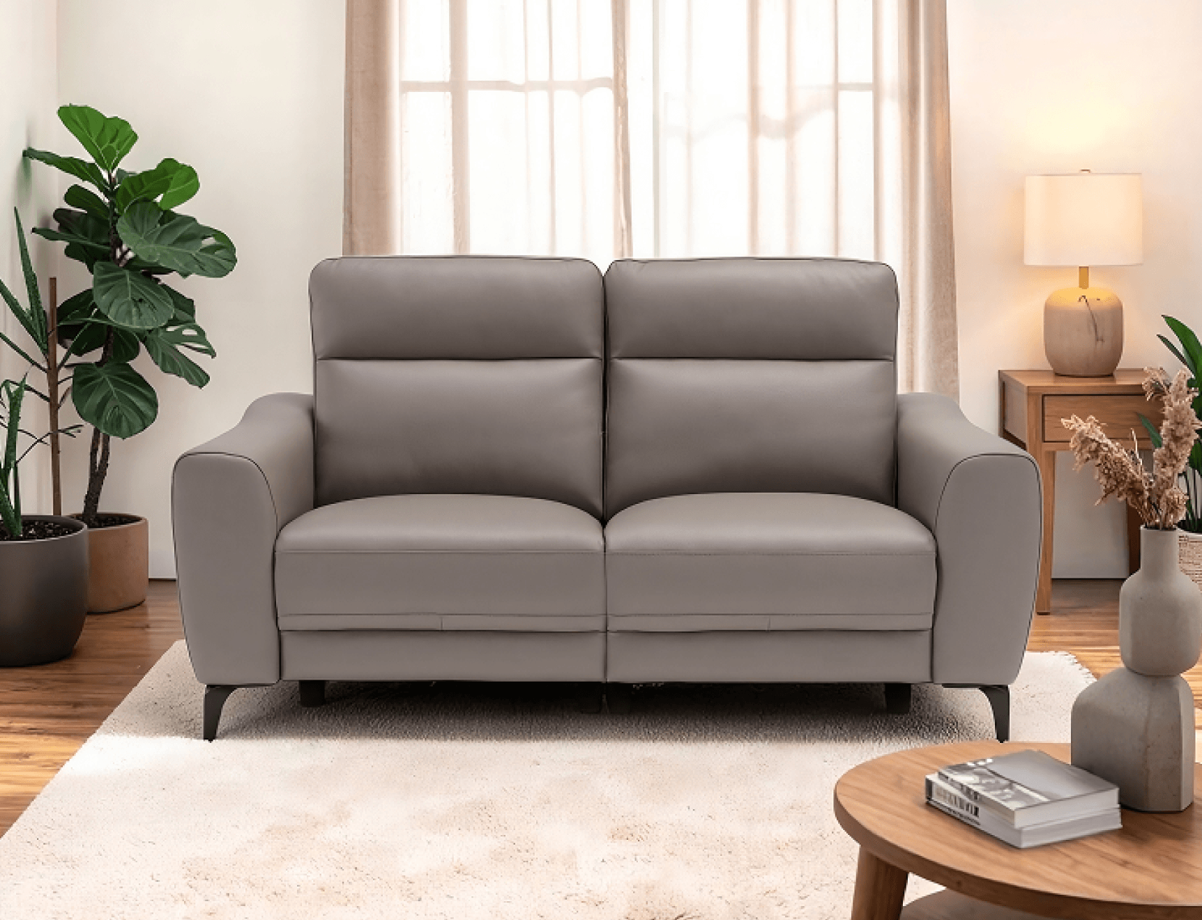 Grey two-seater sofa in a bright living room