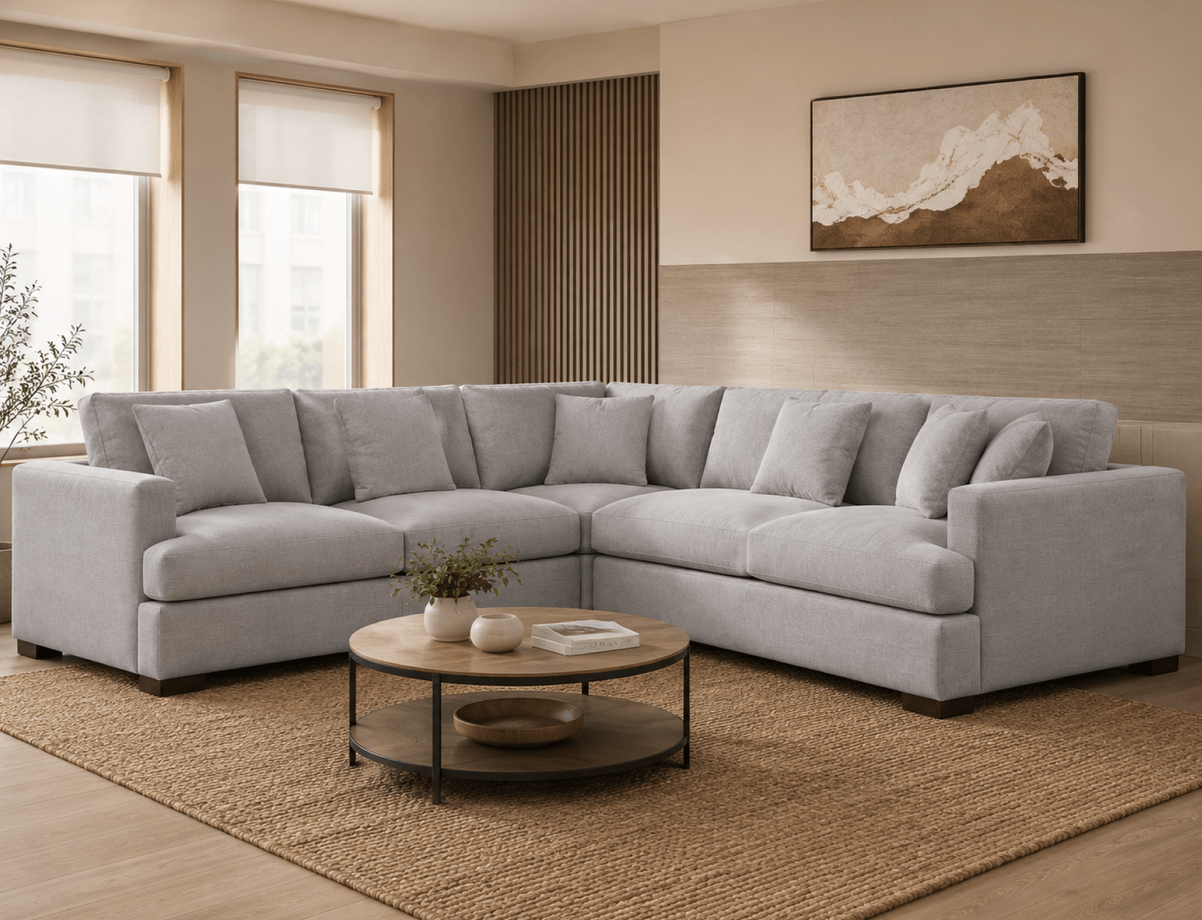 Light grey corner sofa around a round coffee table