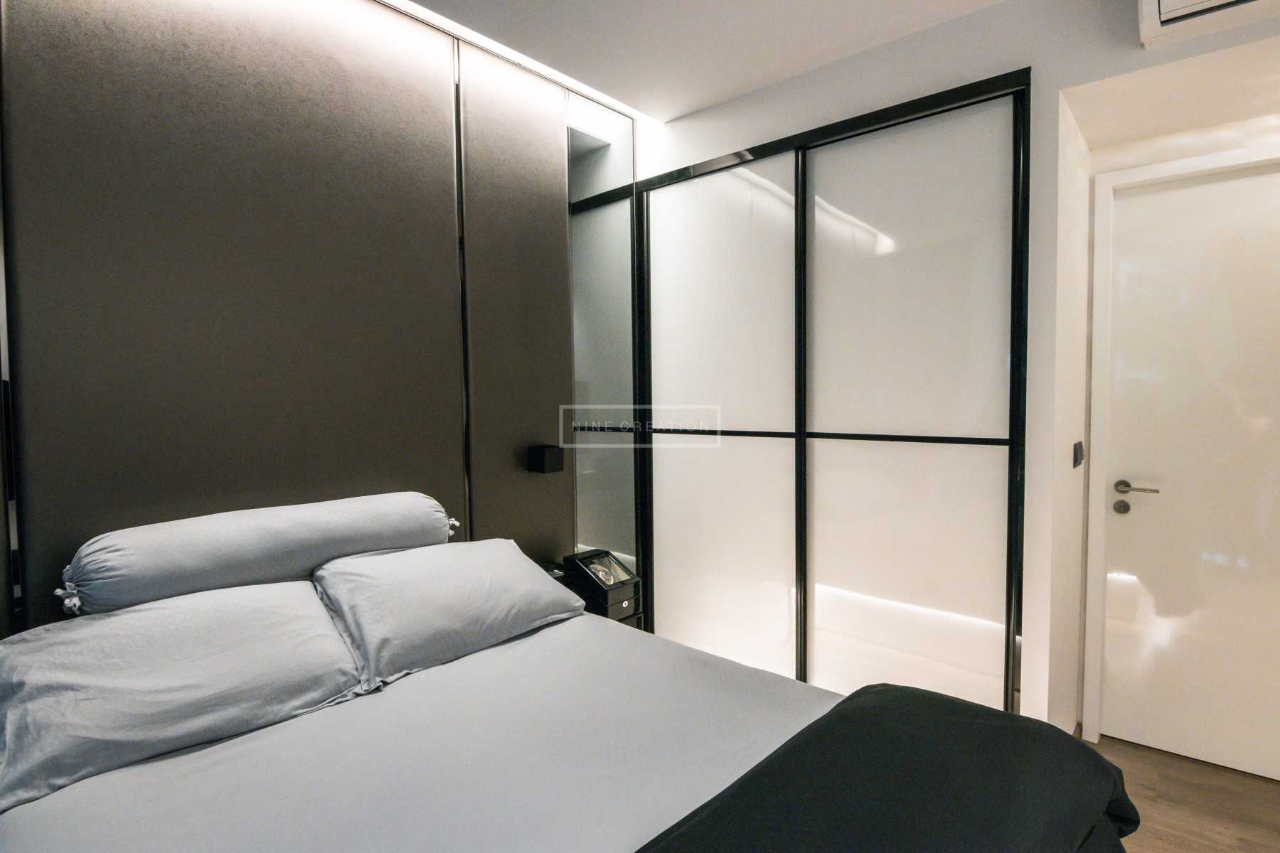 Contemporary Bedroom with Cove Lighting and Wardrobe