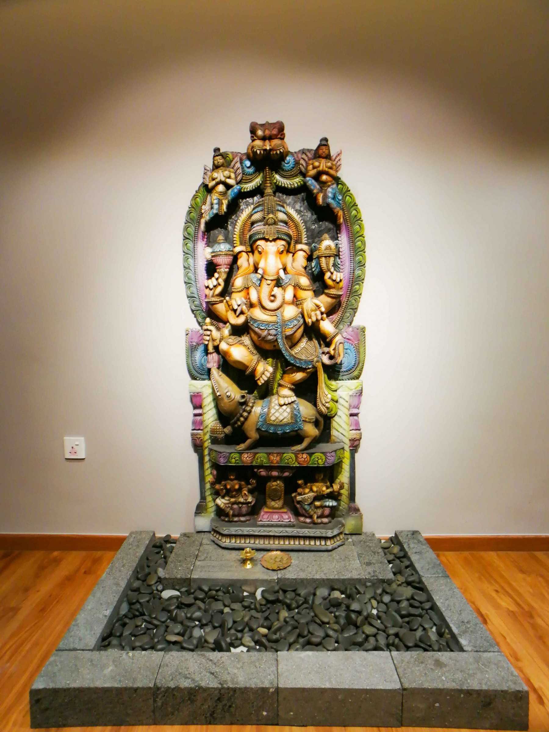 Transitional Entryway with Drop Light and Altar