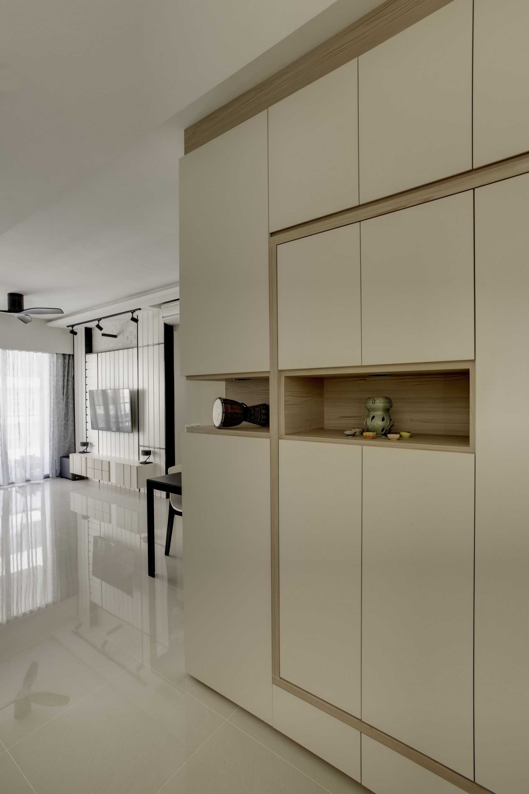 Scandinavian Entryway with Homogeneous Tiles and Shoe Cabinets