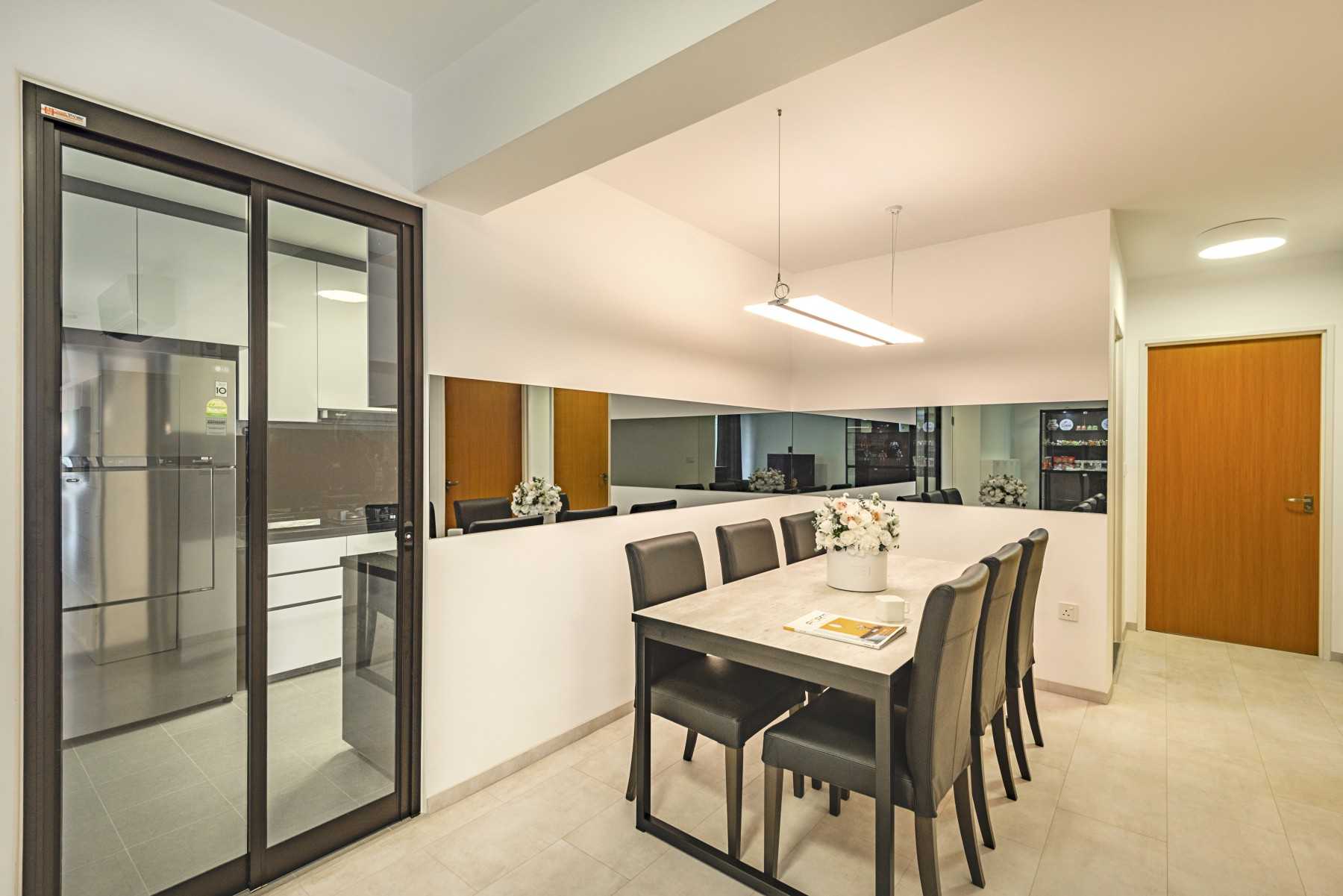 Contemporary Dining Room with Mirror and Glass Door