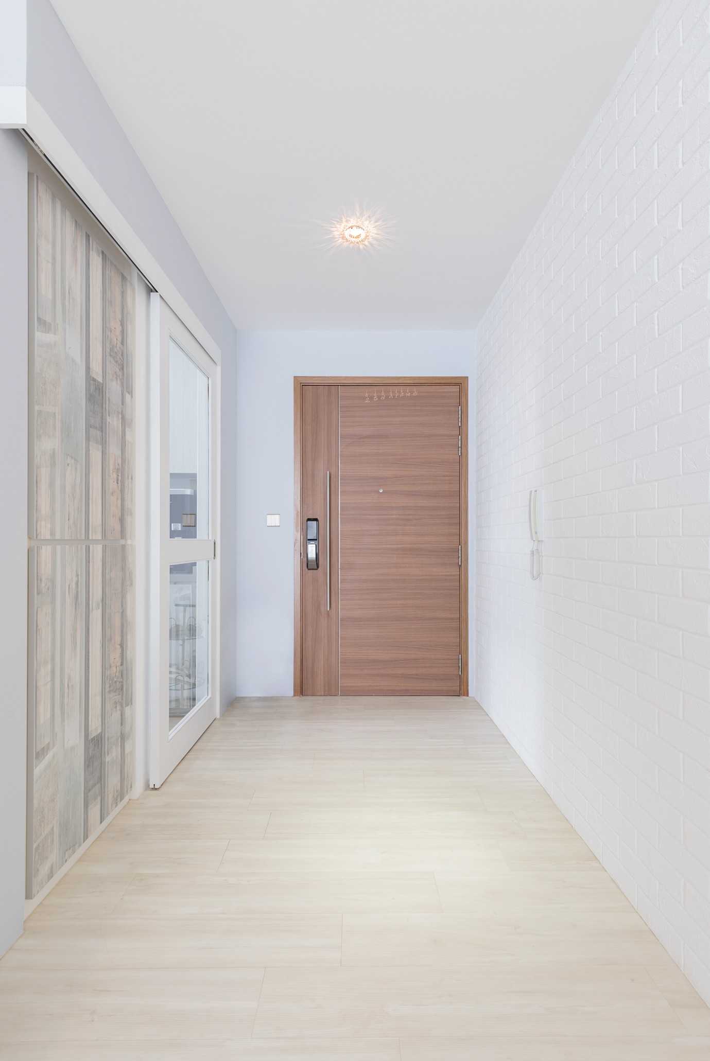 Minimalist Entryway with Doors and Sliding Door
