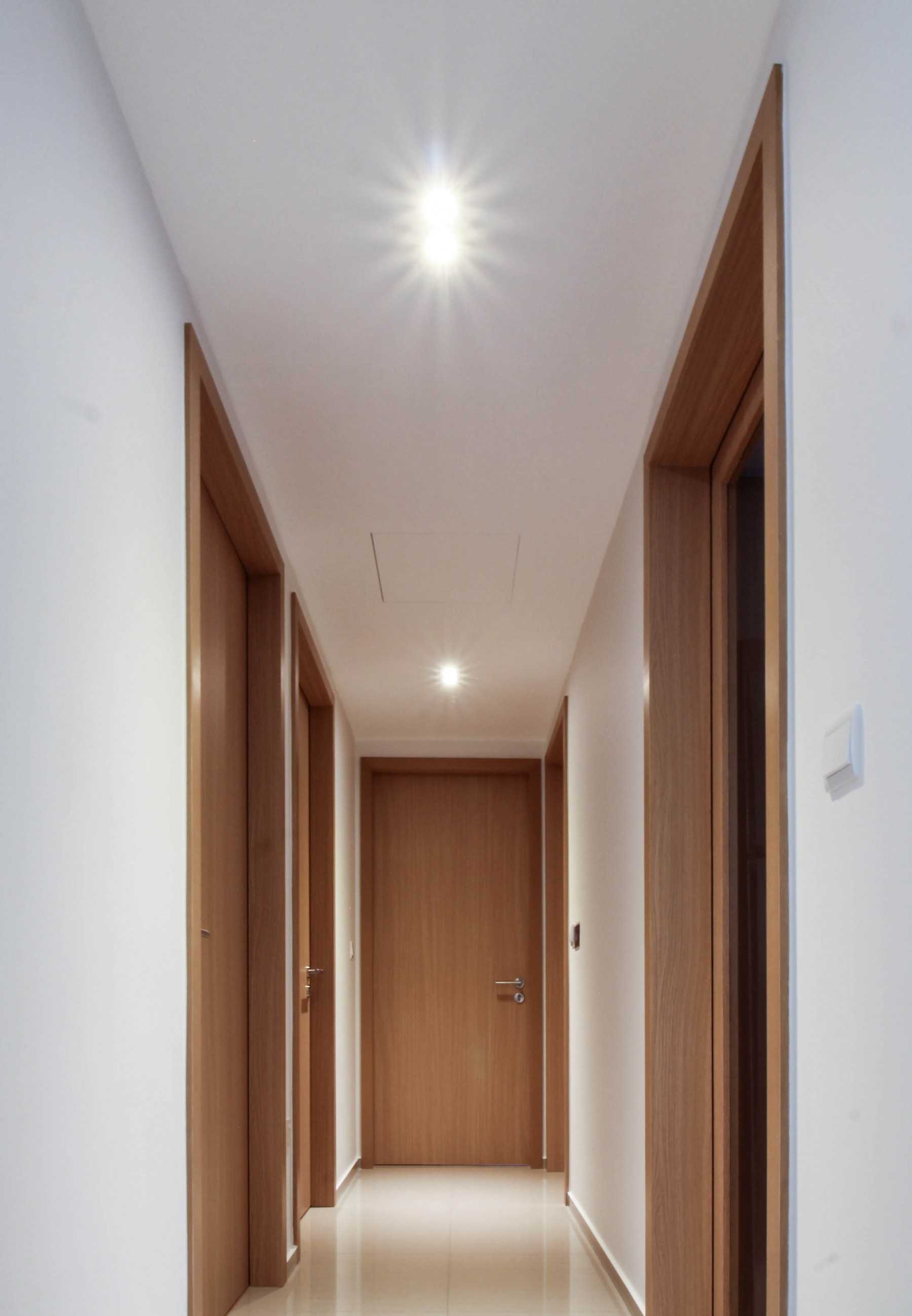 Contemporary Hallway with Doors and Wood Doors