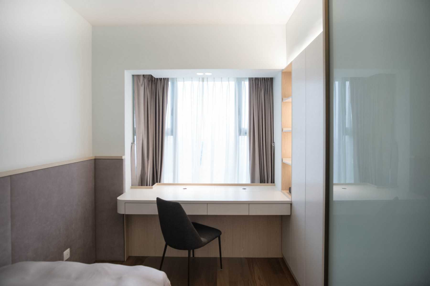 Minimalist Bedroom with Bay Window and Wardrobe