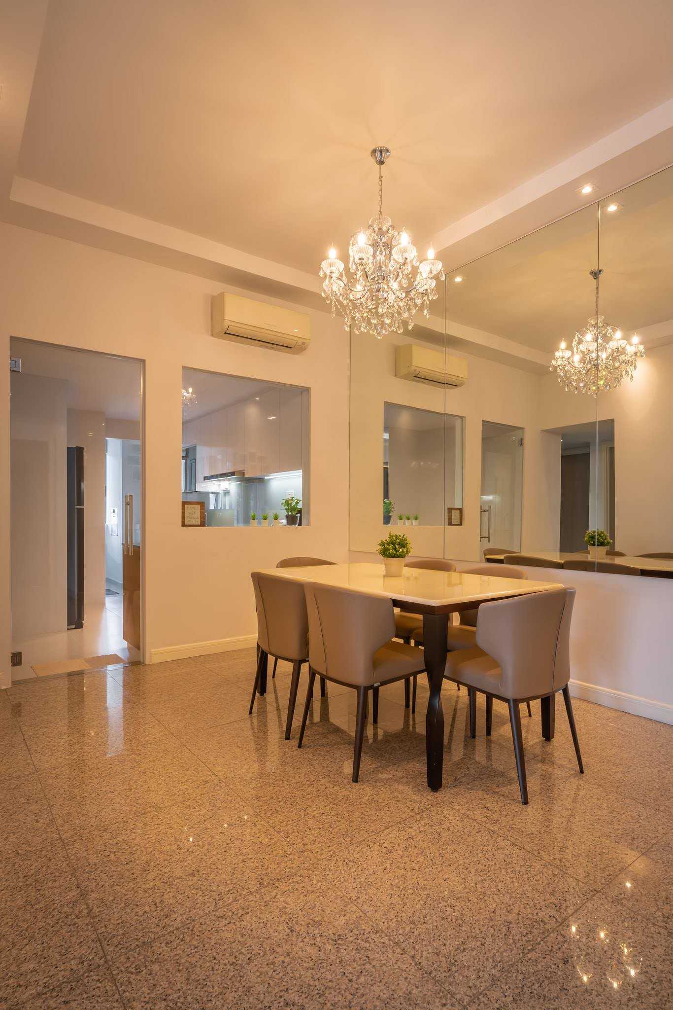 Minimalist Dining Room with Drop Light and Chandelier