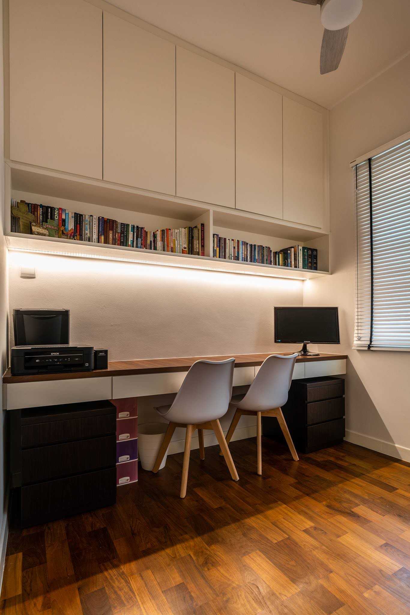 Minimalist Home Office with Bookshelf and Desk Chairs