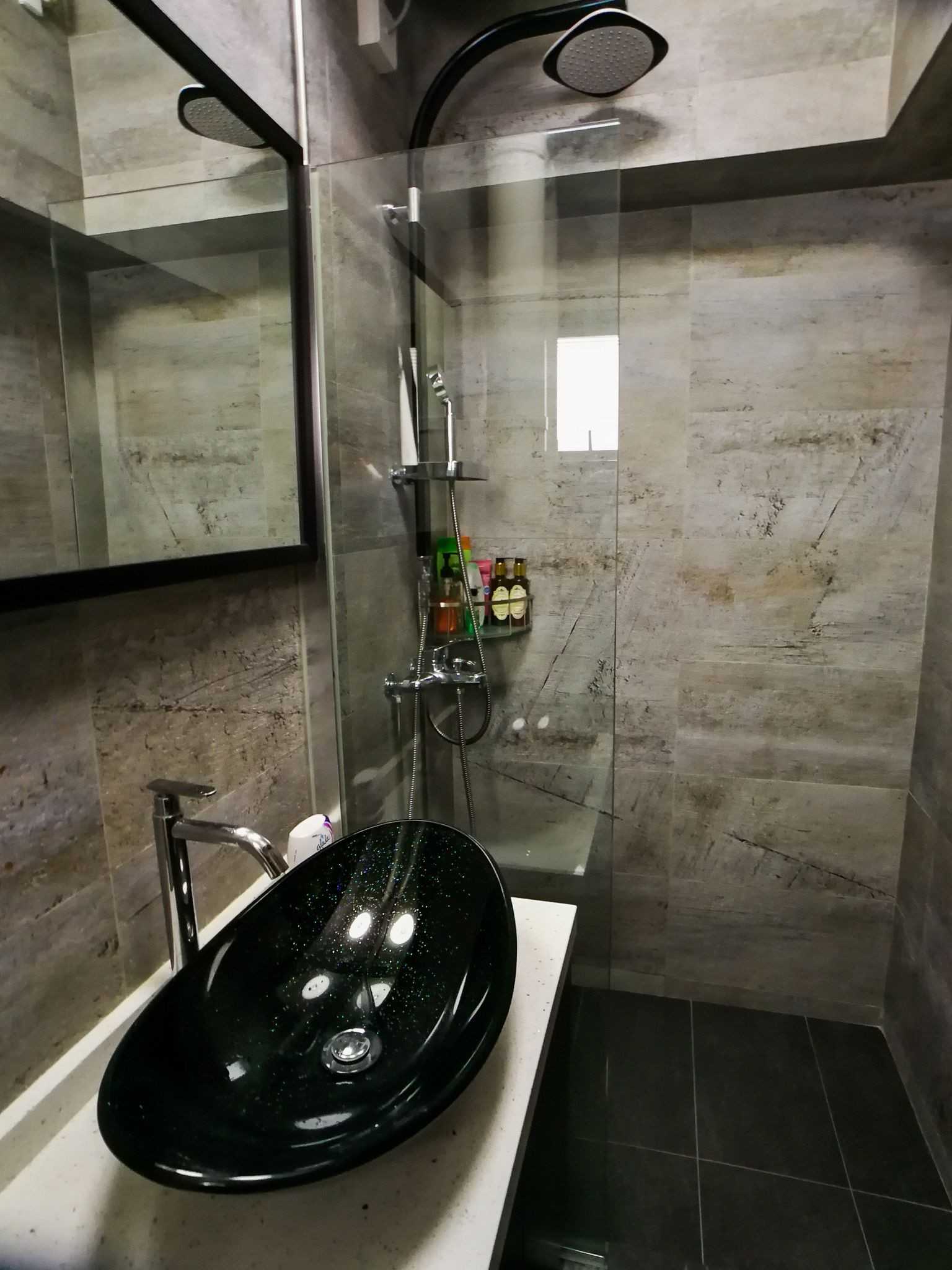 Asian Bathroom with Homogeneous Tiles and Mirror