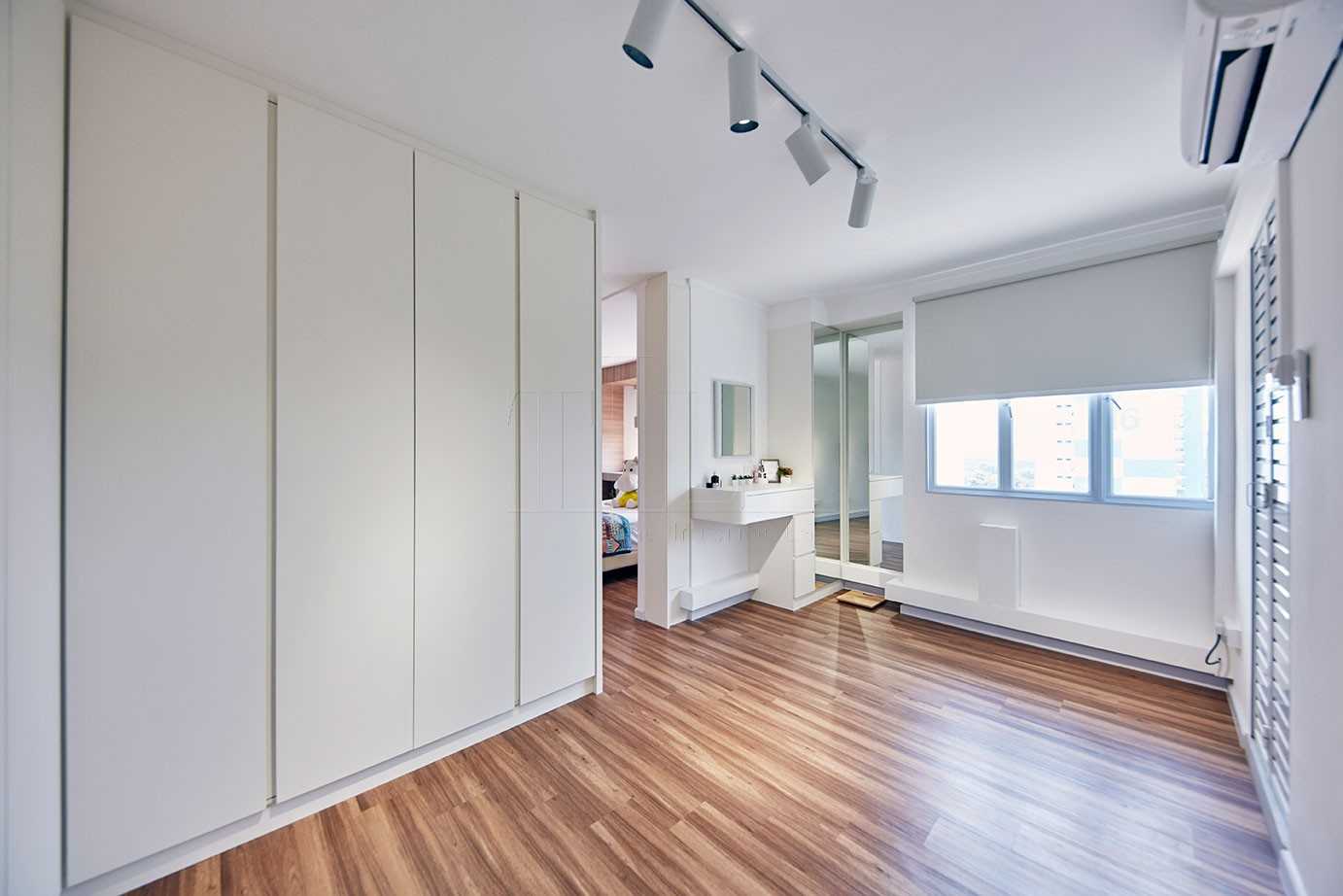 Scandinavian Walk-in Wardrobe with Wood Flooring and Mirror