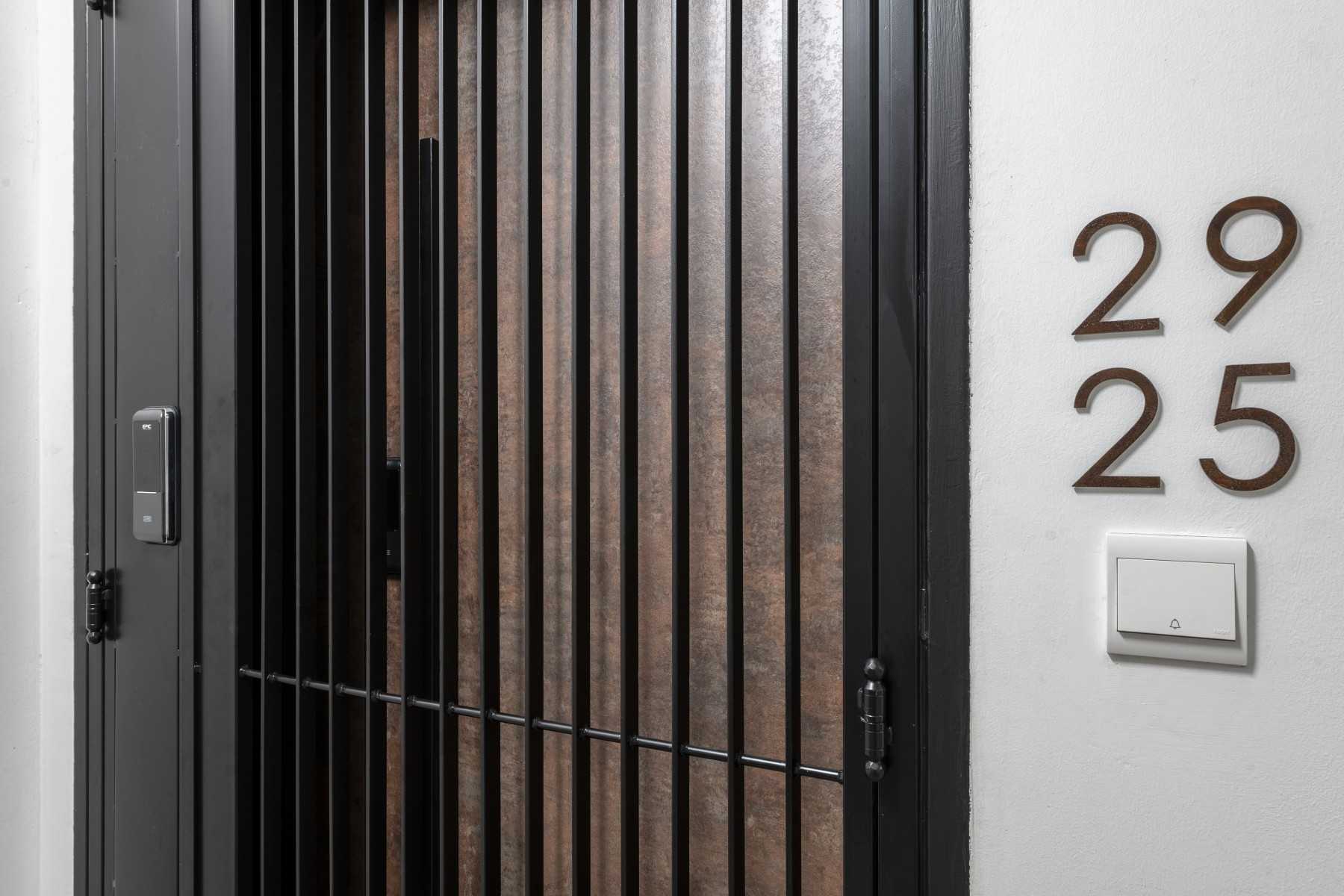 Contemporary Entryway with Metal Gate and Doors