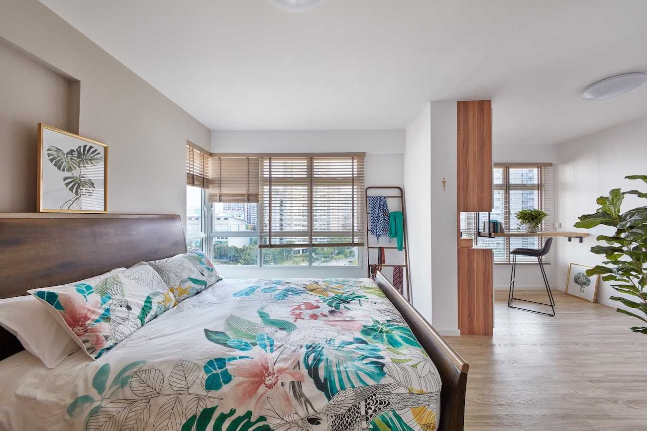 Scandinavian Bedroom with Wood Flooring and Paintings