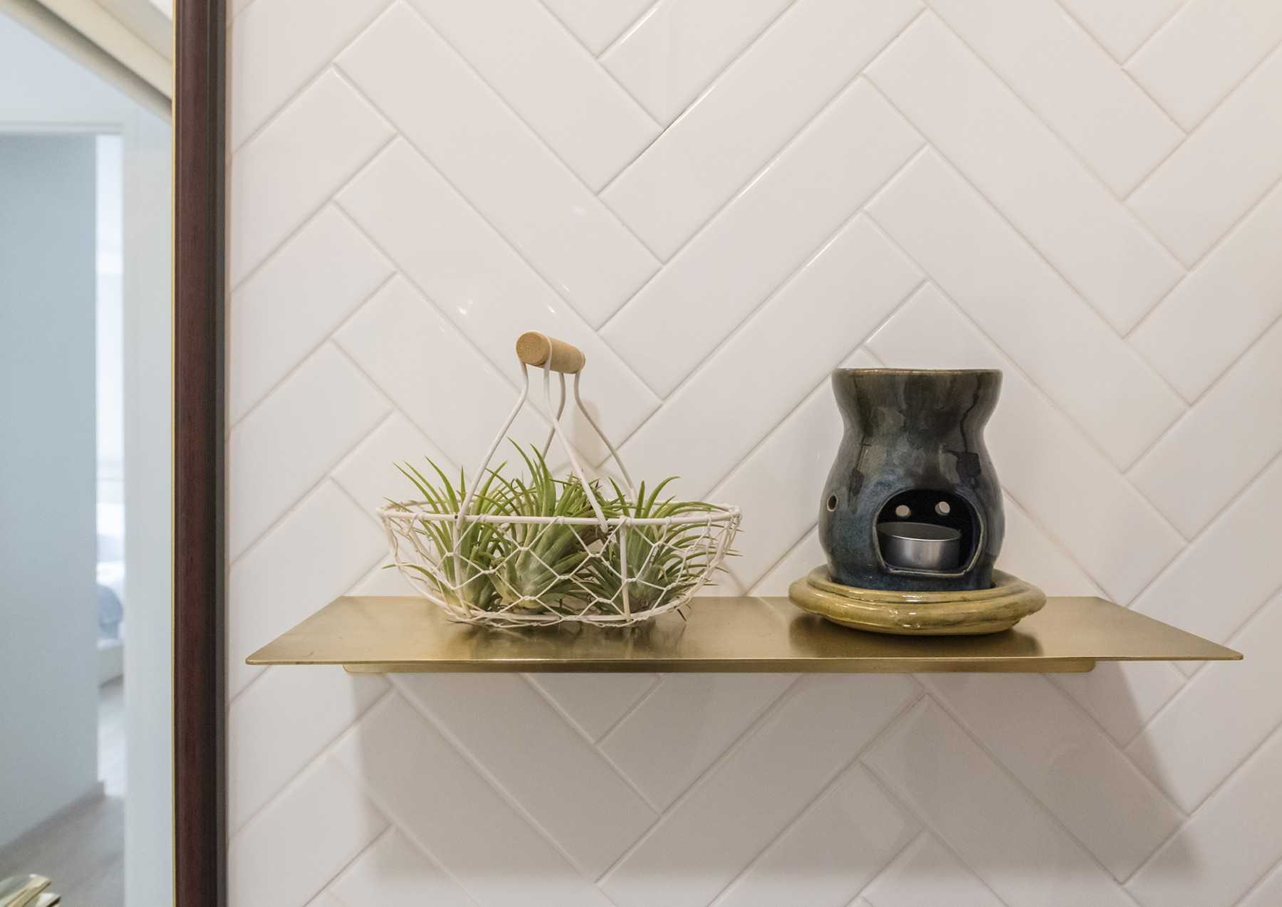 Scandinavian Bathroom with Herringbone Tiling and Wall Shelves