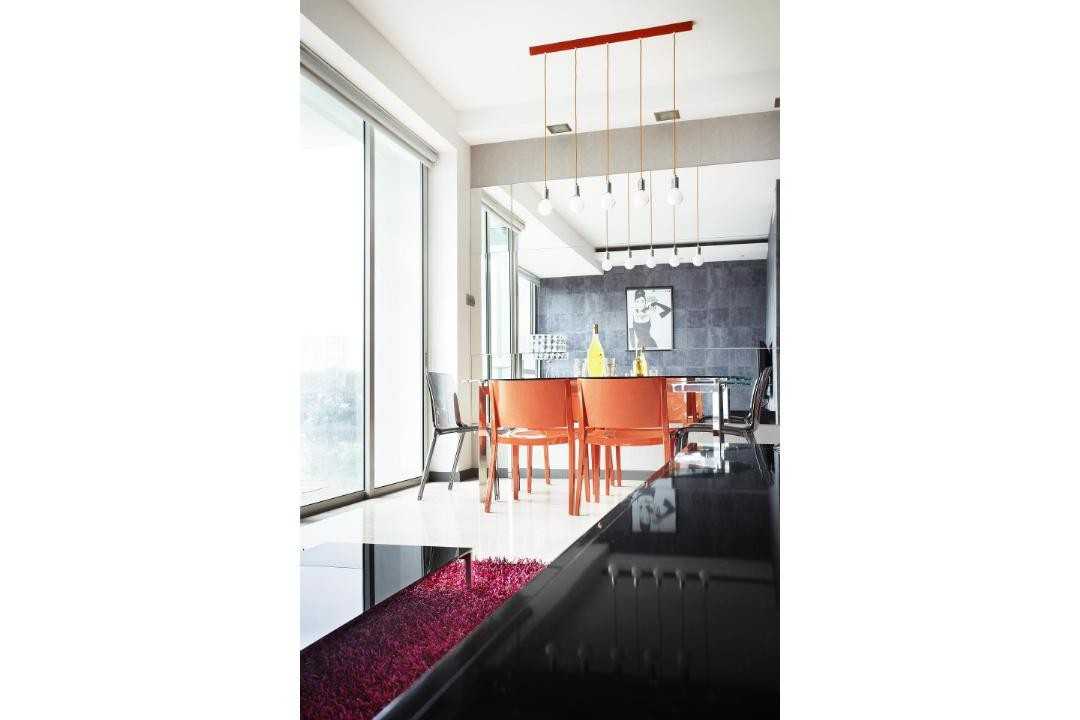 Eclectic Dining Room with Drop Light and Dining Table