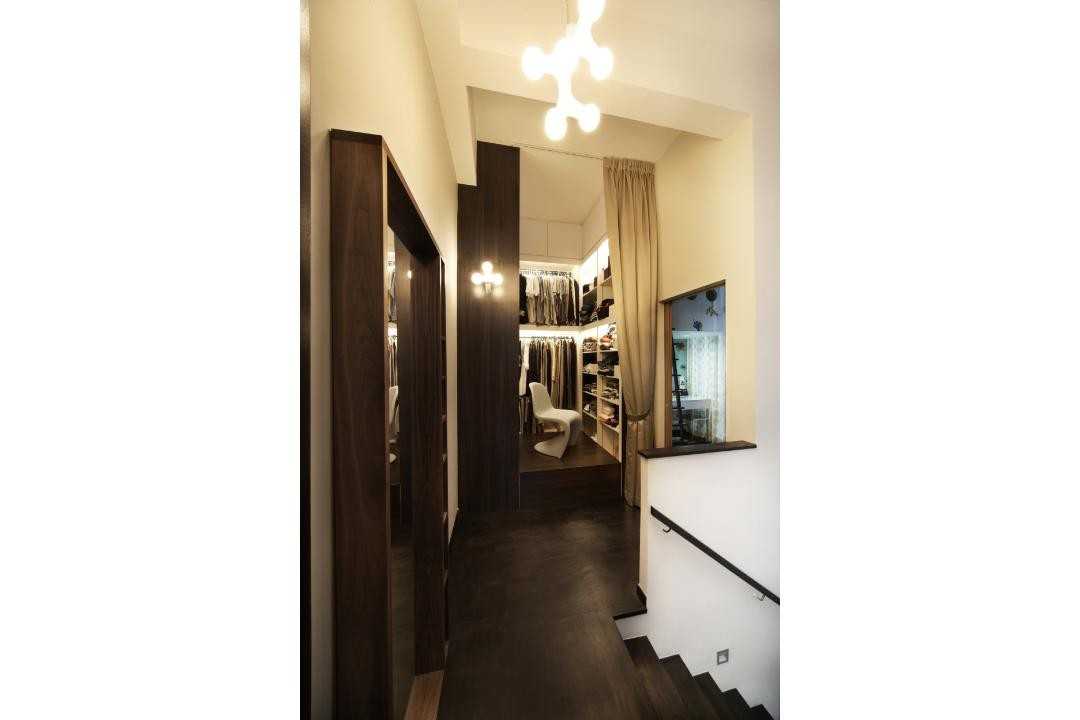 Eclectic Walk-in Wardrobe with Chandelier and Clothes Storage
