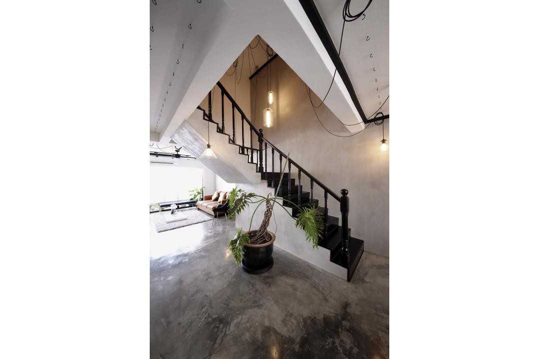 Industrial Hallway with Cement Floor and Staircase