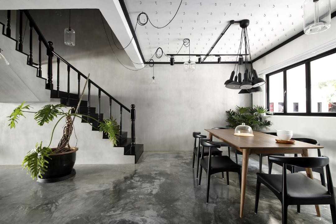 Industrial Dining Room with Cement Floor and Drop Light