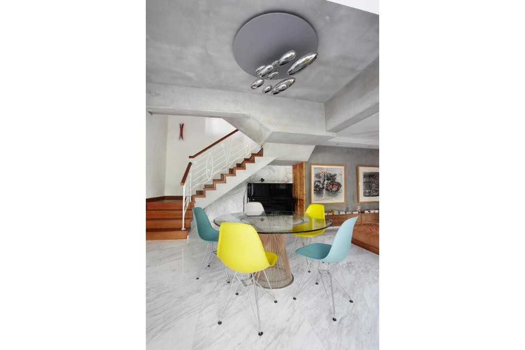 Eclectic Dining Room with Marble Floor and Staircase