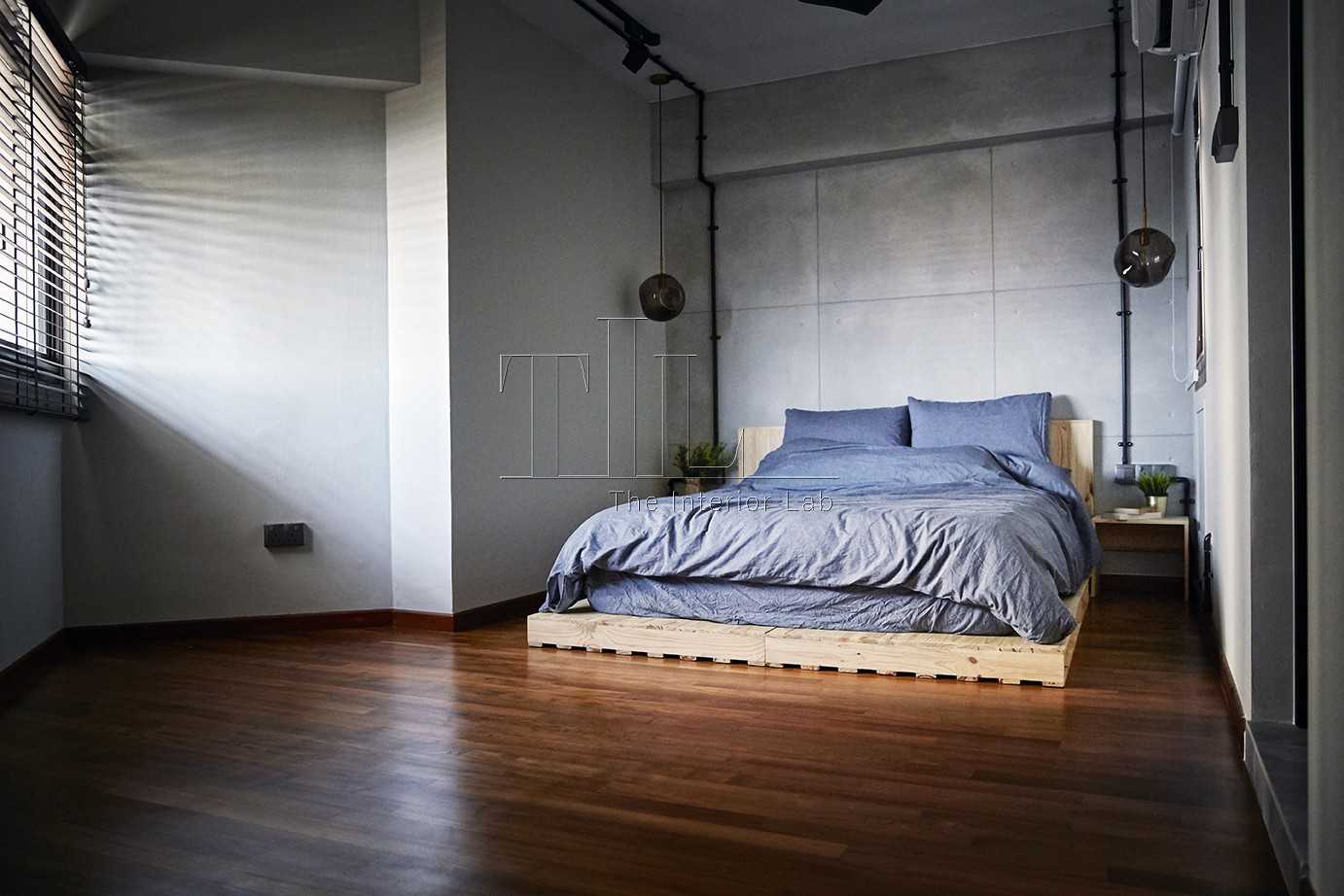 Industrial Bedroom with Wood Flooring and Feature Wall