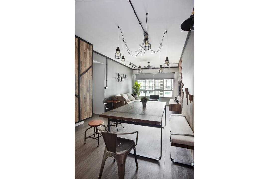 Industrial Dining Room with Drop Light and Dining Table