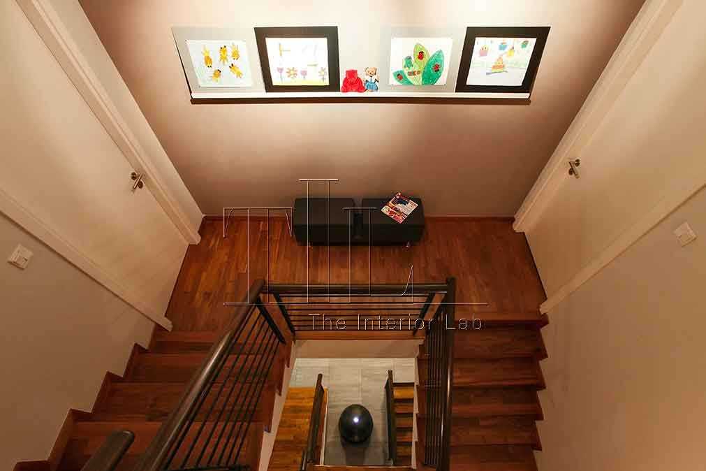 Transitional Hallway with Staircase and Artwork