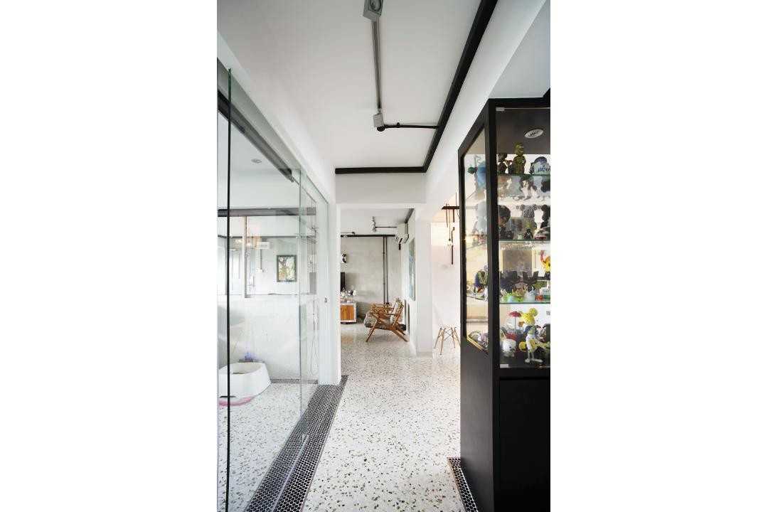 Eclectic Hallway with Display Cabinets and Room Divider