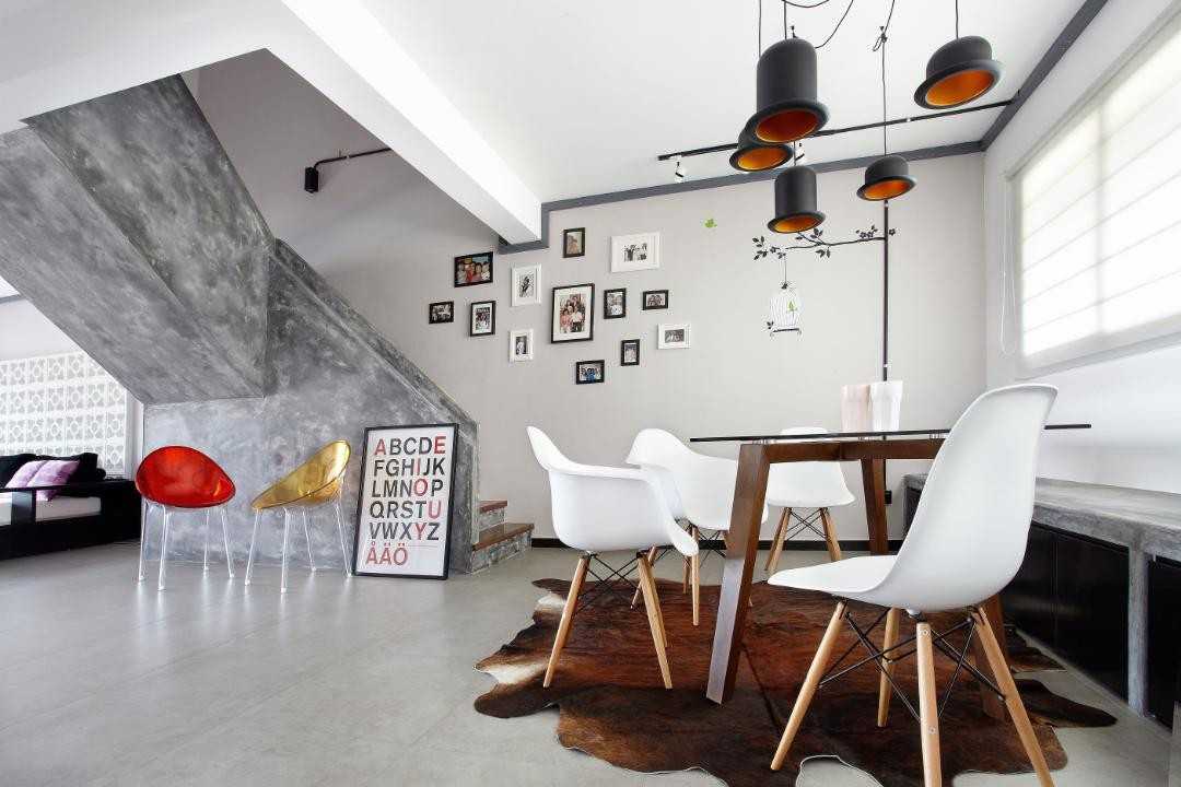 Industrial Dining Room with Drop Light and Dining Table