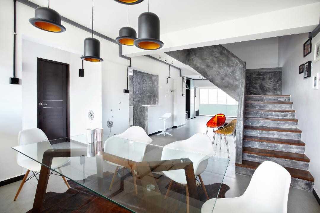 Industrial Dining Room with Drop Light and Dining Table
