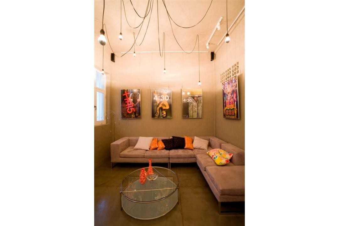 Eclectic Living Room with Drop Light and Sofa