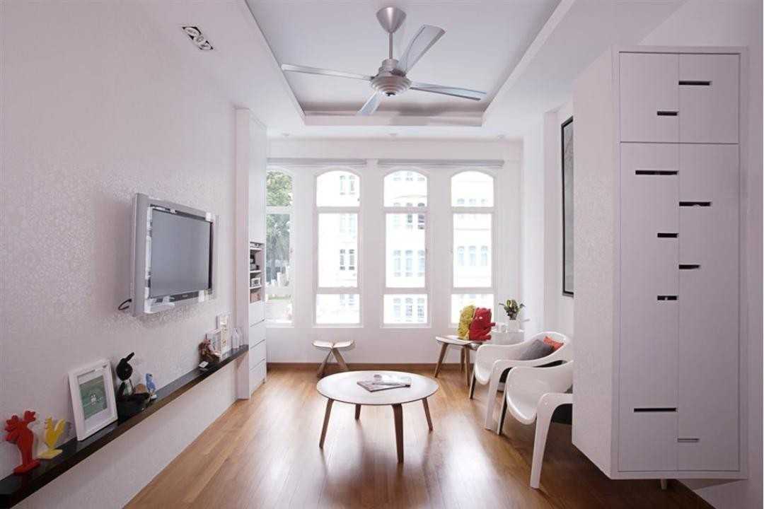 Eclectic Living Room with Wood Flooring and Armchairs
