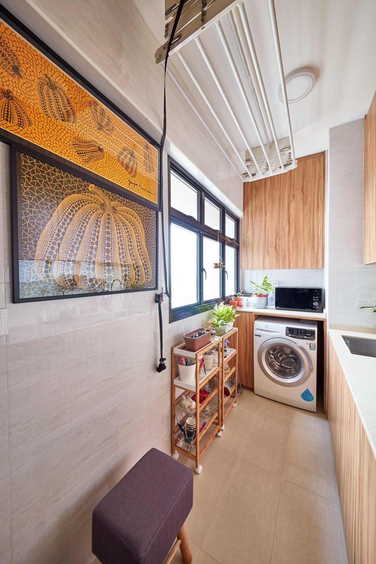 Eclectic Service Yard with Washing Machine and Paintings