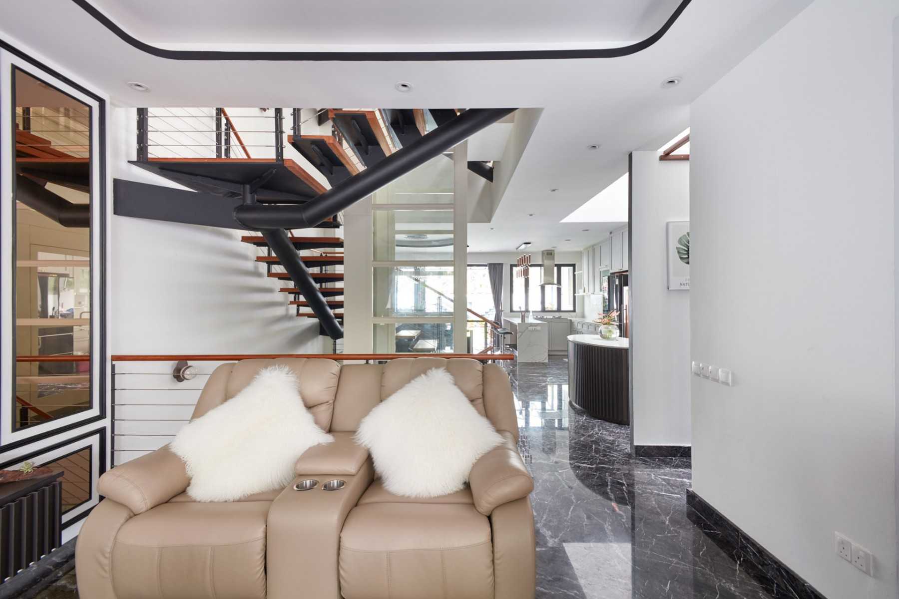 Modern Hallway with Staircase and Armchairs