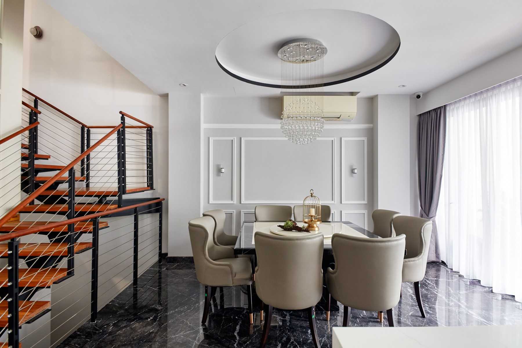Modern Dining Room with Staircase and Chandelier