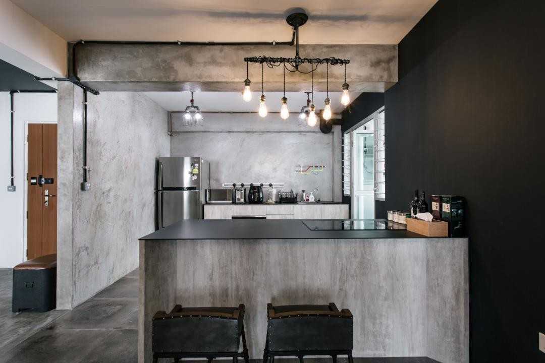 Industrial Kitchen with Drop Light and Bar Counter