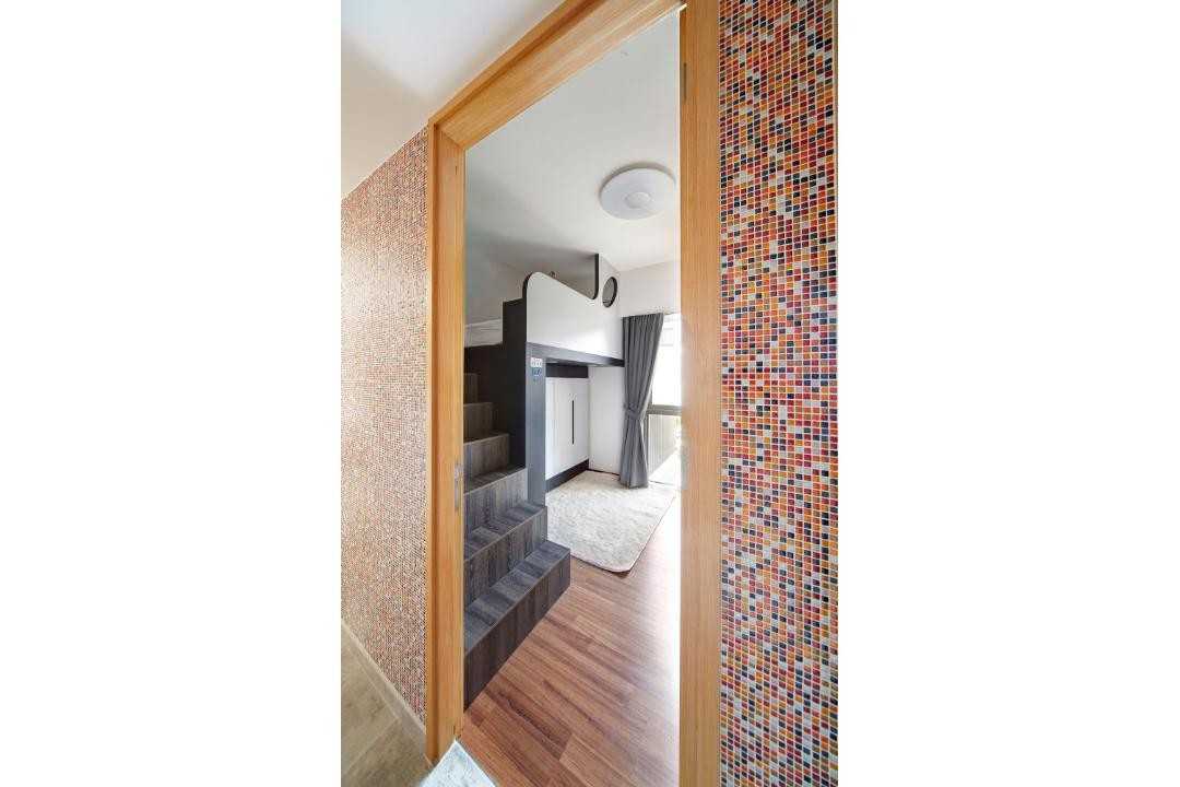 Eclectic Hallway with Staircase and Bed