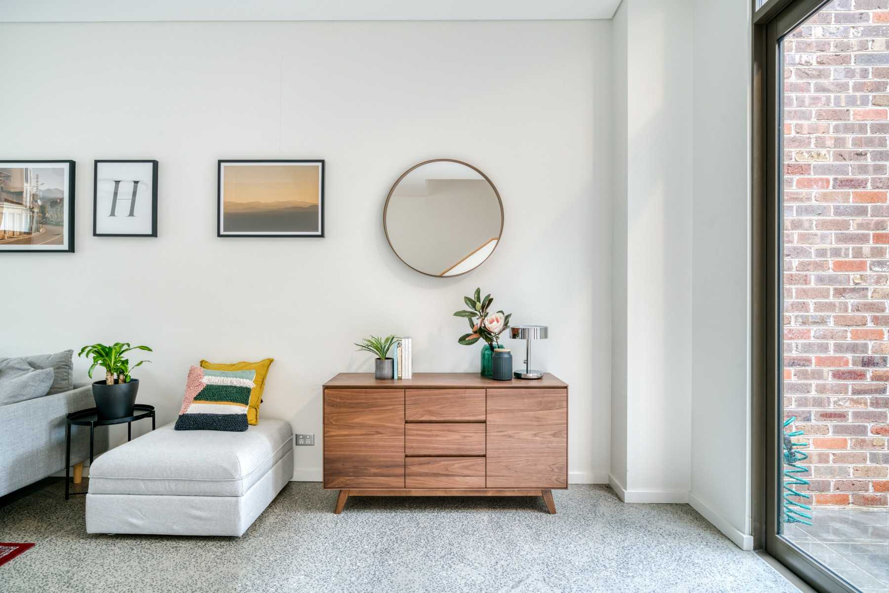 Eclectic Living Room with Mirror and Sideboard