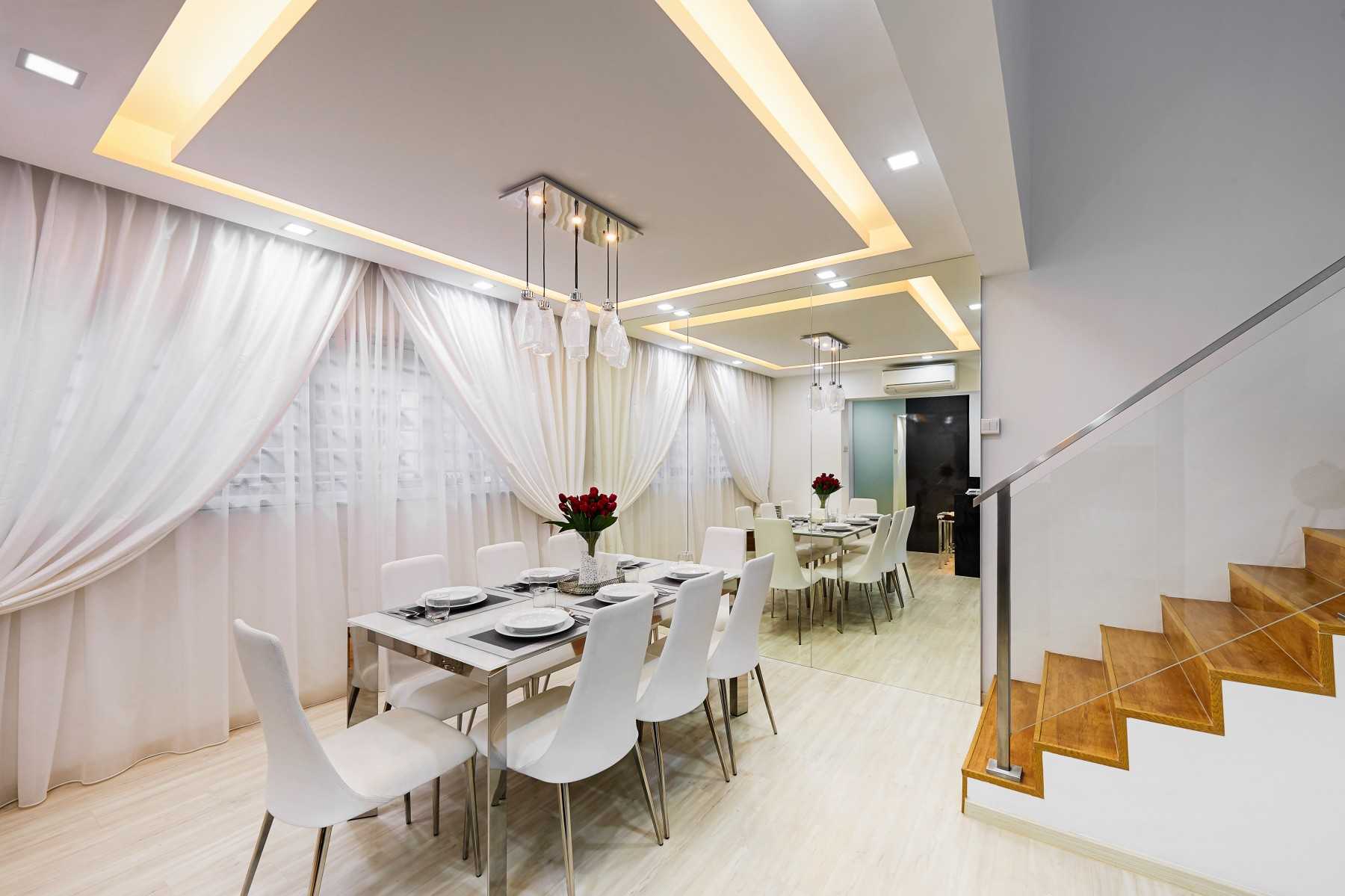 Modern Dining Room with Drop Light and Mirror