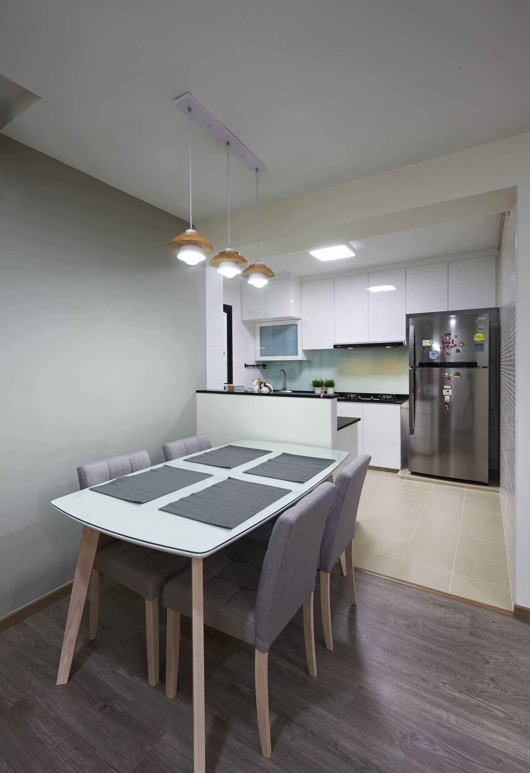 Scandinavian Dining Room with Wood Flooring and Drop Light