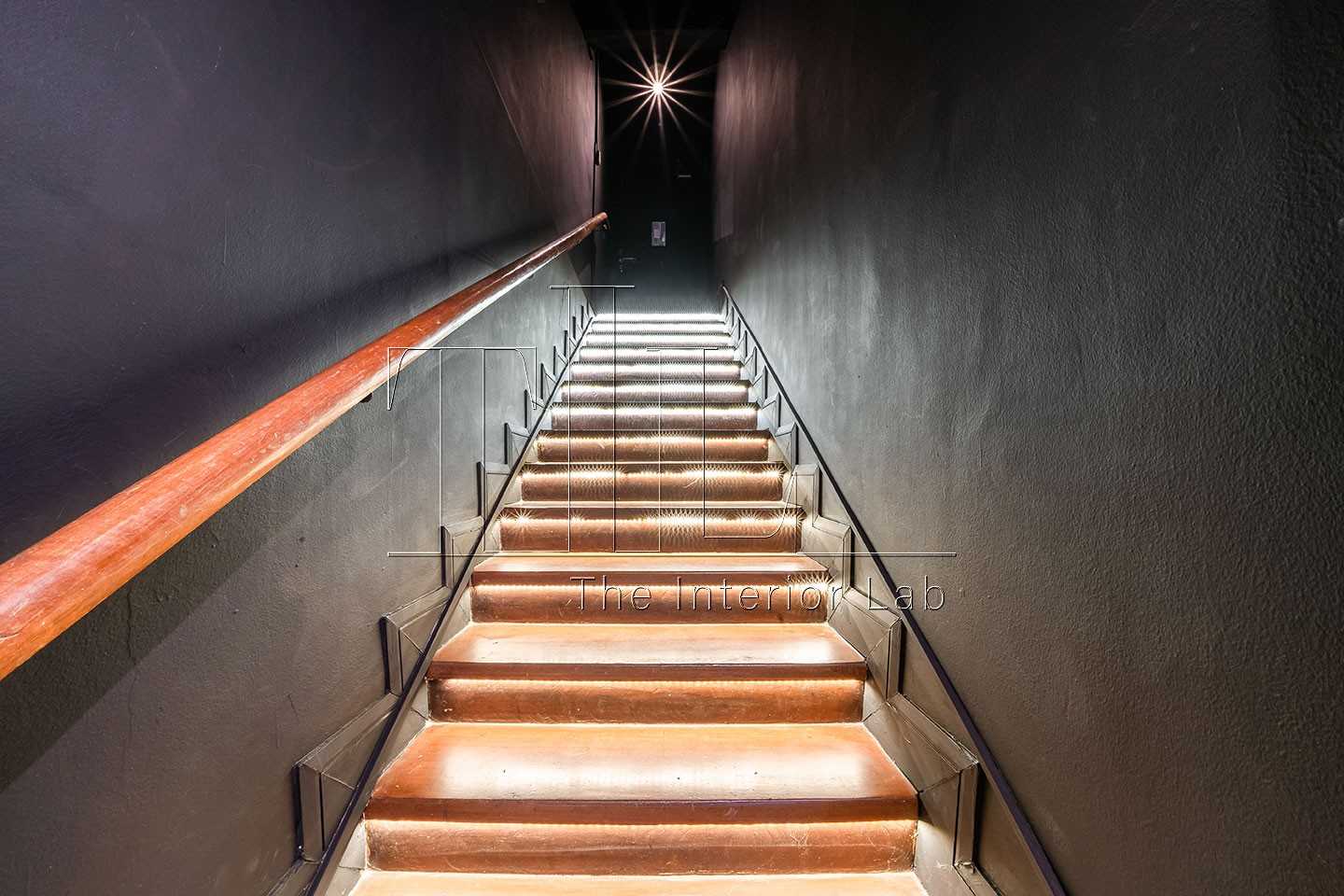 Industrial Entryway with Staircase and Metal Gate