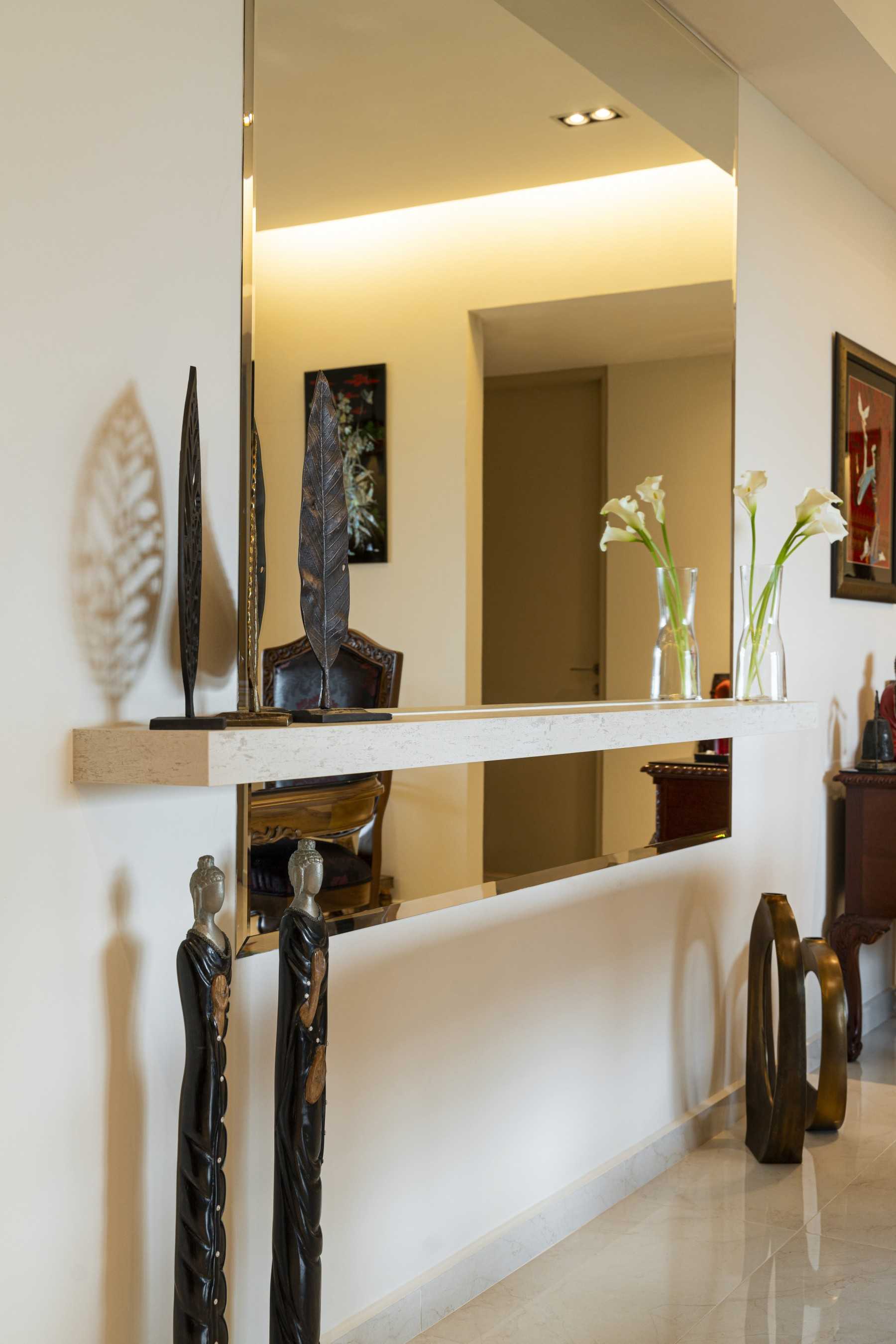 Modern Hallway with Mirror and Artwork