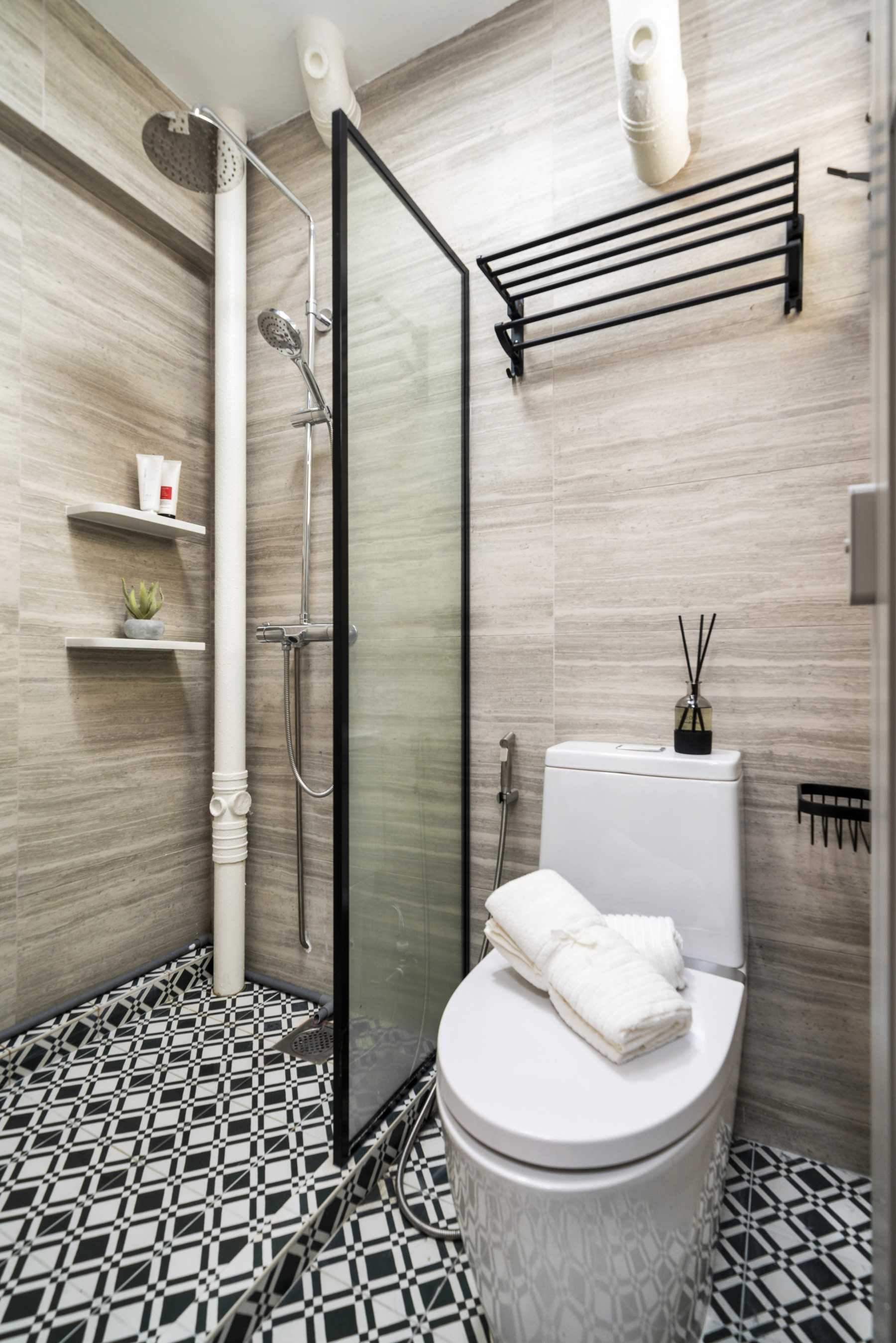 Minimalist Bathroom with Homogeneous Tiles and Shower Screen