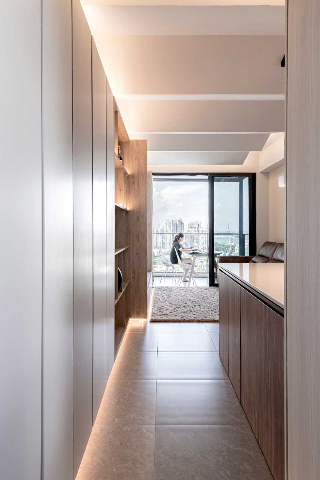 Modern Hallway with Bookshelf and Artwork